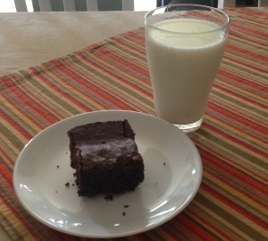 Post-workout recovery brownie and glass of milk