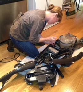 Shannon Wilkinson fixing the carpet cleaner.